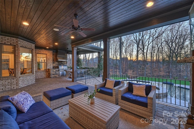 view of patio featuring area for grilling, outdoor lounge area, and ceiling fan