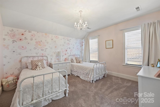 bedroom with visible vents, carpet flooring, vaulted ceiling, baseboards, and wallpapered walls