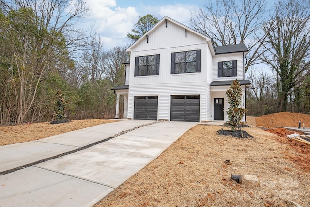 modern farmhouse style home featuring a garage