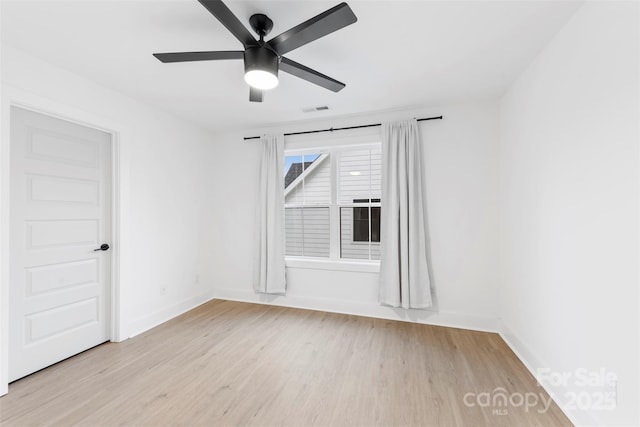 unfurnished room with ceiling fan and light hardwood / wood-style flooring