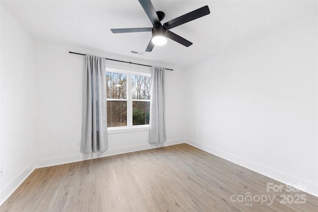 spare room with ceiling fan and light hardwood / wood-style flooring