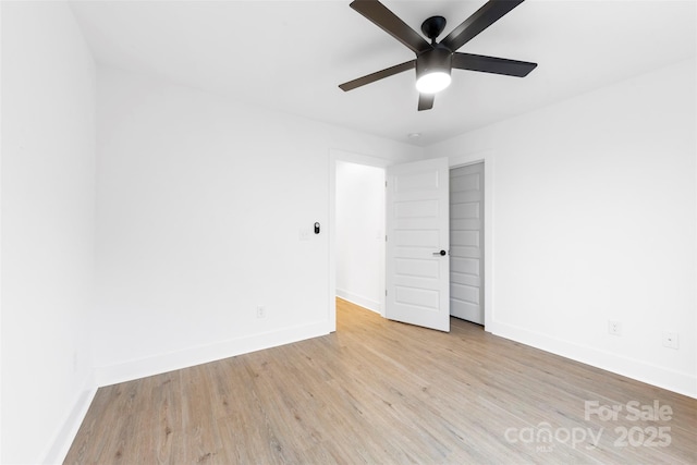 empty room featuring light wood-type flooring and ceiling fan