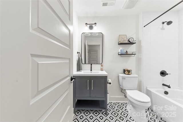 full bathroom featuring toilet, vanity, and tiled shower / bath