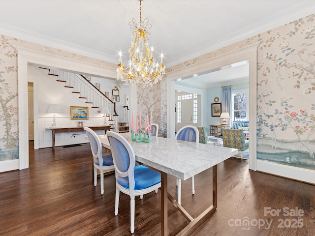 dining space with wallpapered walls, dark wood-style floors, and stairway
