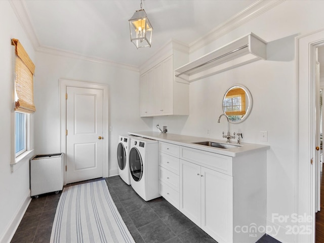 washroom with baseboards, radiator heating unit, a sink, cabinet space, and independent washer and dryer