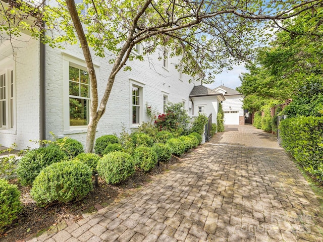 view of side of property with brick siding