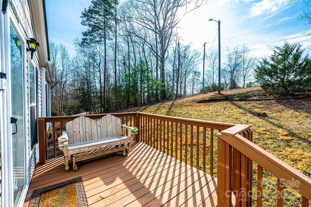 deck featuring a lawn