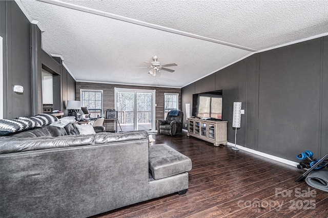 living room featuring ornamental molding, vaulted ceiling, ceiling fan, and dark hardwood / wood-style flooring