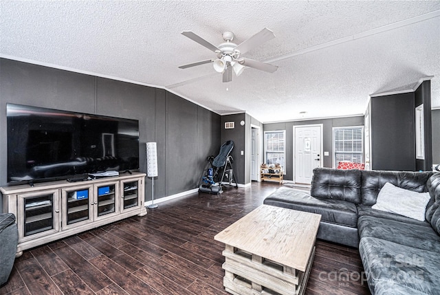 living room with dark wood-type flooring, crown molding, vaulted ceiling, a textured ceiling, and ceiling fan