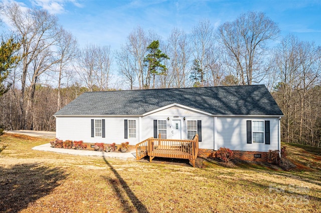 view of front facade featuring a front yard and a deck