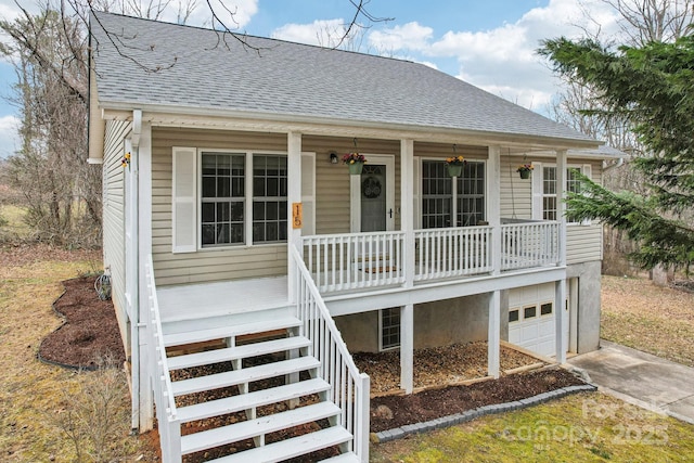 view of front of home with a garage and covered porch