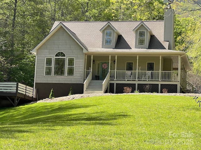 view of front of home with a front yard and covered porch