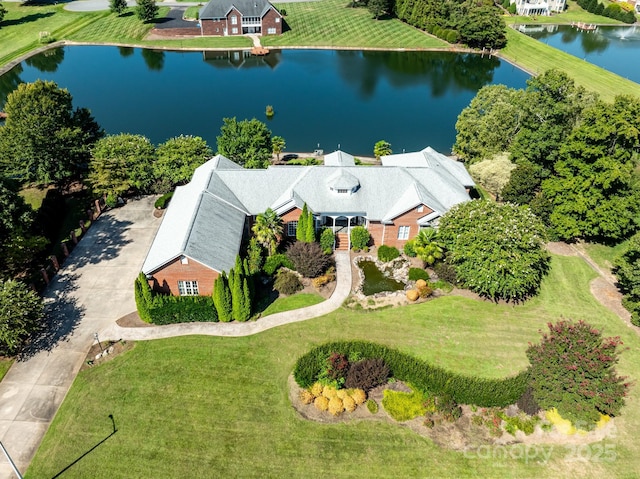 birds eye view of property featuring a water view