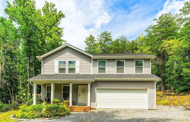 view of front of property with a garage and covered porch