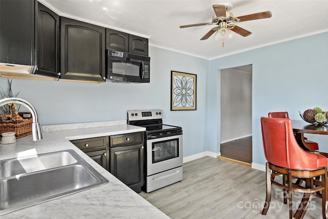 kitchen featuring sink, ornamental molding, electric stove, ceiling fan, and light hardwood / wood-style floors