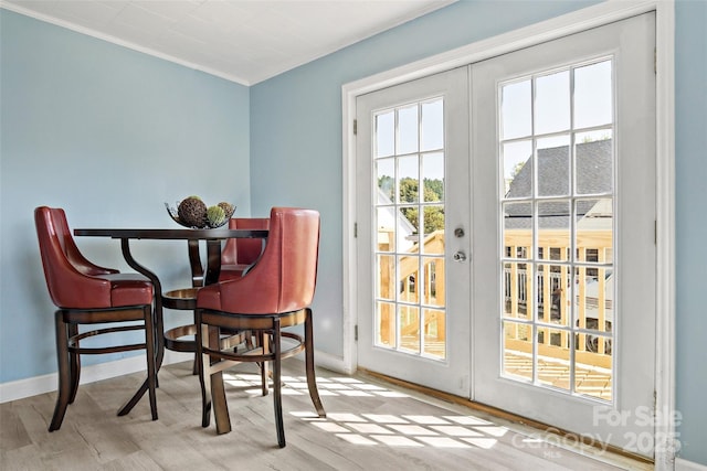 interior space with french doors and light hardwood / wood-style flooring