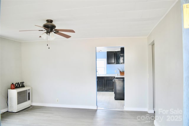 spare room featuring ceiling fan and light hardwood / wood-style floors