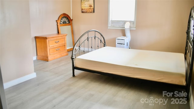 bedroom featuring light hardwood / wood-style floors