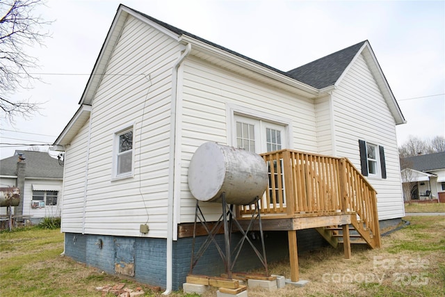 back of property with a deck