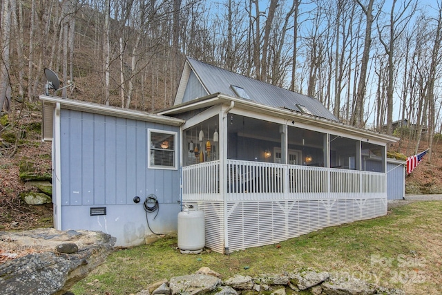 view of home's exterior featuring a sunroom