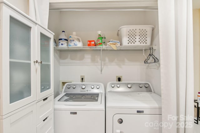 washroom featuring independent washer and dryer