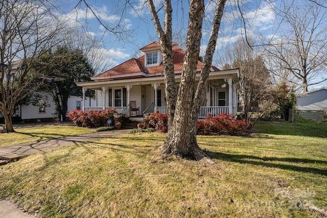 view of front of home featuring a porch and a front lawn