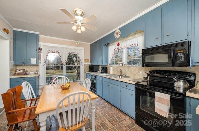 kitchen featuring sink, black appliances, and blue cabinets