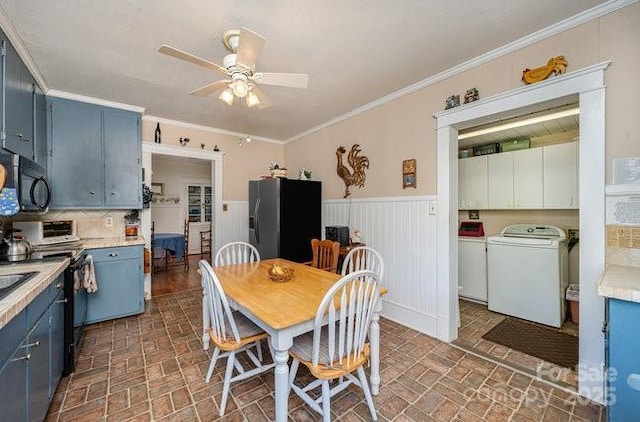 dining space featuring ornamental molding, ceiling fan, and washer and clothes dryer