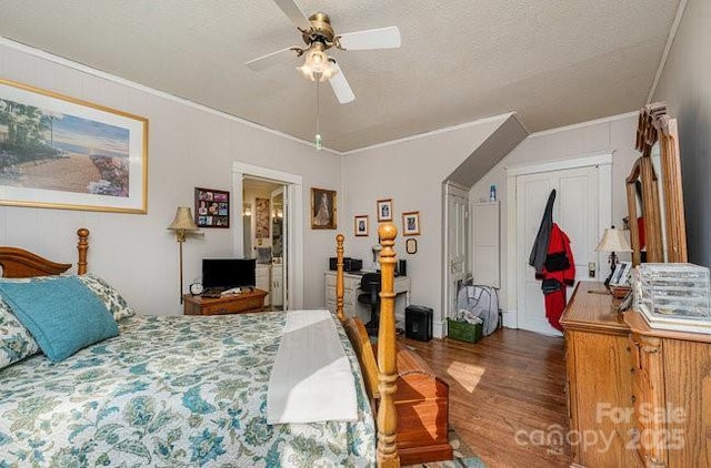 bedroom with crown molding, dark hardwood / wood-style floors, and a textured ceiling