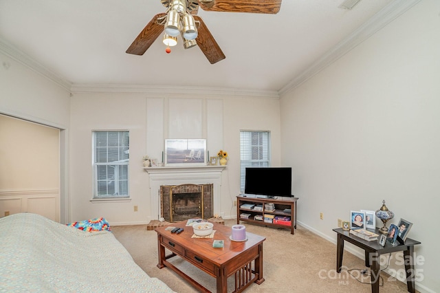 living room featuring ornamental molding, light carpet, and ceiling fan