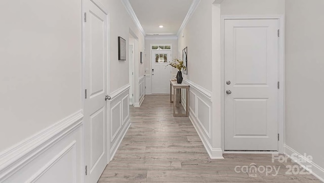108 Sari St, Troutman, NC 28166 - hall featuring a decorative wall, ornamental molding, light wood-type flooring, a wainscoted wall, and recessed lighting