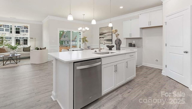 108 Sari St, Troutman, NC 28166 - kitchen with stainless steel dishwasher, crown molding, light countertops, white cabinets, and open floor plan