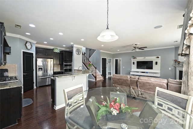 dining area with stairs, dark wood-style floors, visible vents, and recessed lighting