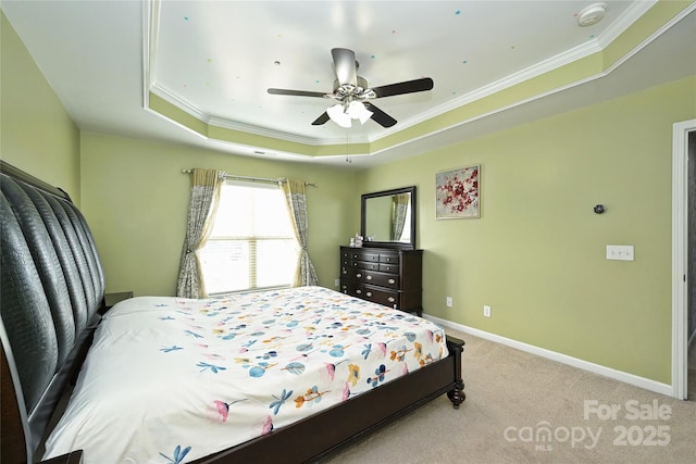 bedroom featuring light carpet, ornamental molding, a raised ceiling, and baseboards