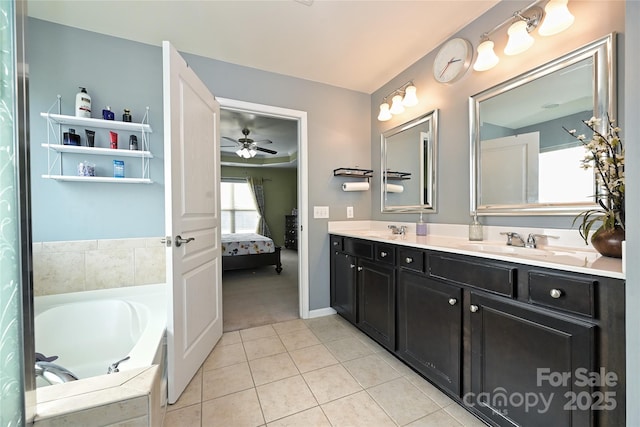 ensuite bathroom with double vanity, connected bathroom, a sink, tile patterned flooring, and a bath