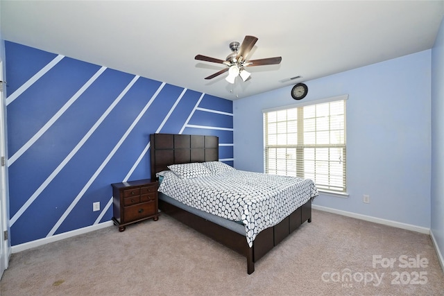 bedroom featuring carpet floors, baseboards, visible vents, and a ceiling fan