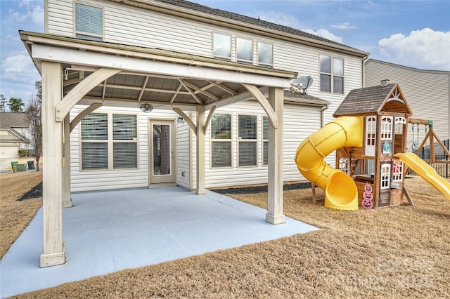 view of jungle gym featuring a patio area and a gazebo