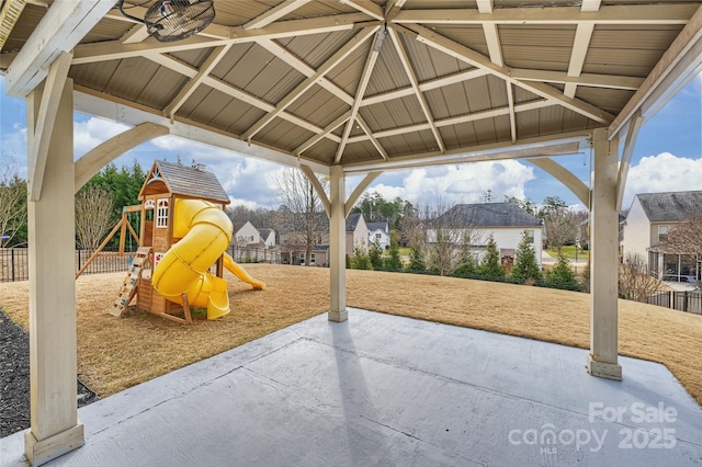 view of play area with a patio area, fence, and a gazebo