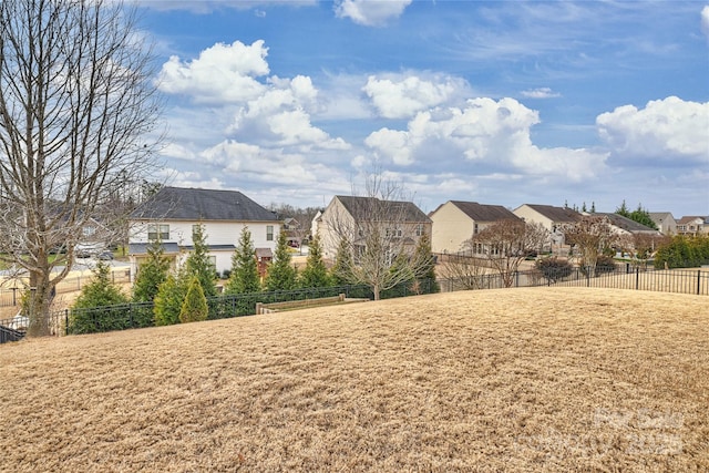 view of yard with fence and a residential view