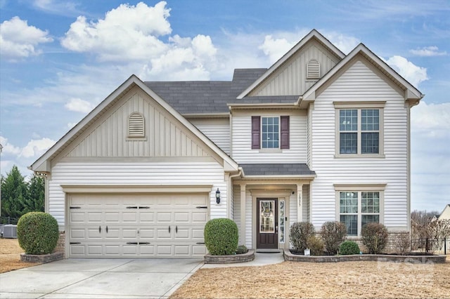 view of front facade with a garage, driveway, a shingled roof, and board and batten siding