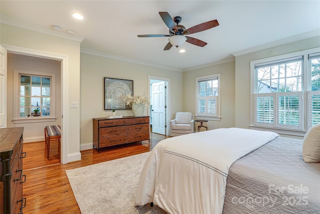 bedroom with wood-type flooring, ceiling fan, and crown molding