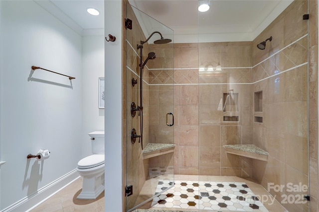 bathroom featuring ornamental molding, toilet, tile patterned flooring, and a shower with door