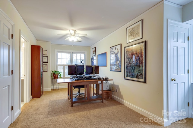 office space featuring ornamental molding, light carpet, and ceiling fan