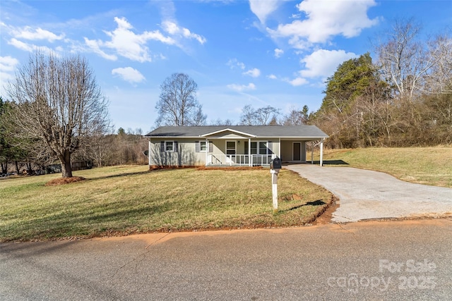 single story home featuring covered porch, a front yard, and a carport