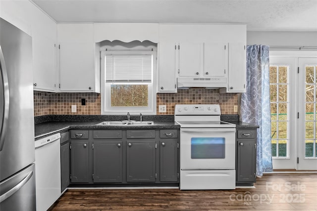 kitchen with gray cabinets, sink, white appliances, and white cabinets