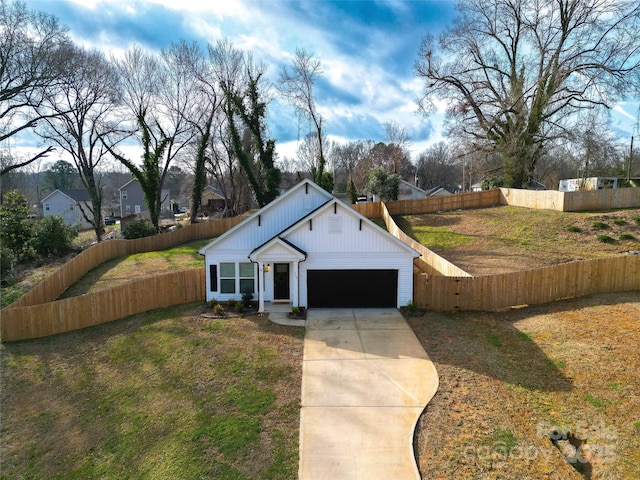 view of front of home featuring a garage and a front yard