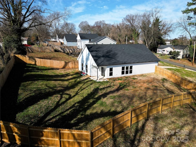 view of side of property with a lawn