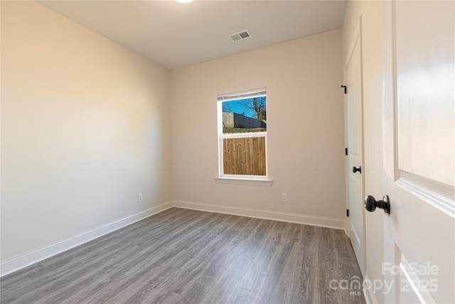 empty room featuring hardwood / wood-style flooring