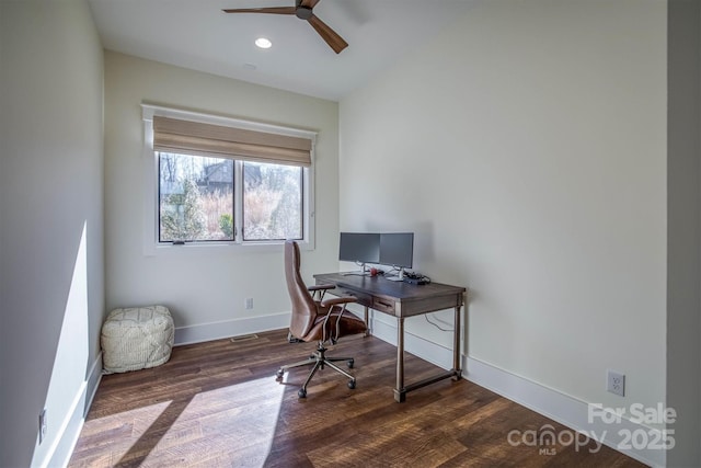 office space featuring dark wood-type flooring and ceiling fan