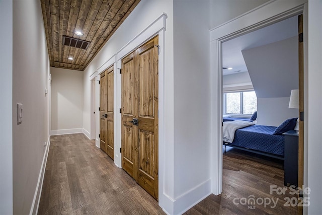 hall with dark hardwood / wood-style floors